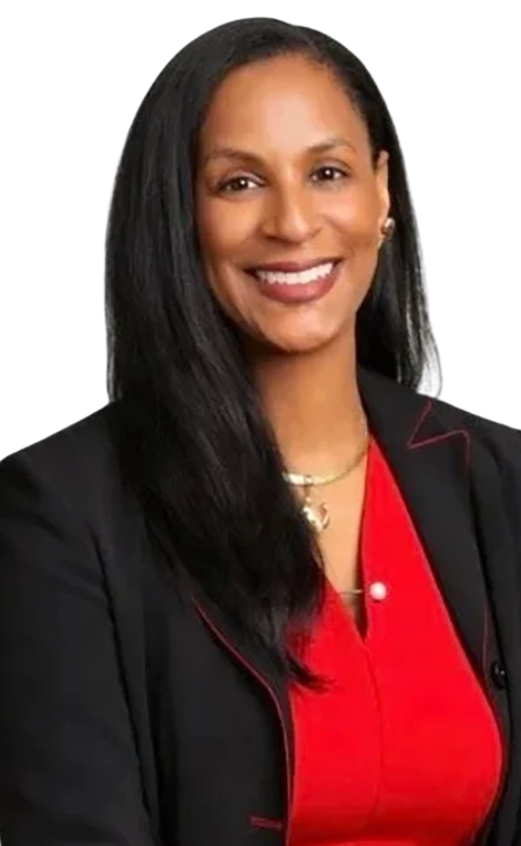 Portrait of Amara Hunter smiling in a black blazer and red top.
