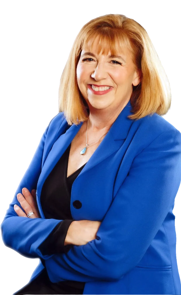 Portrait of Marsie West smiling with arms crossed, wearing a bright blue blazer.