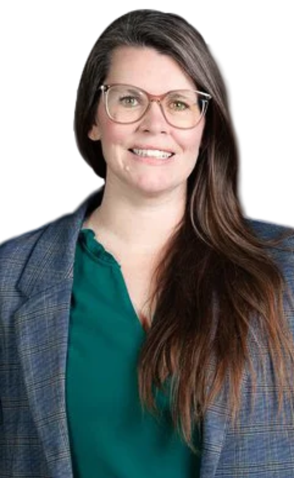 Portrait of Jen Wiles smiling, wearing glasses, a gray blazer, and a green top.